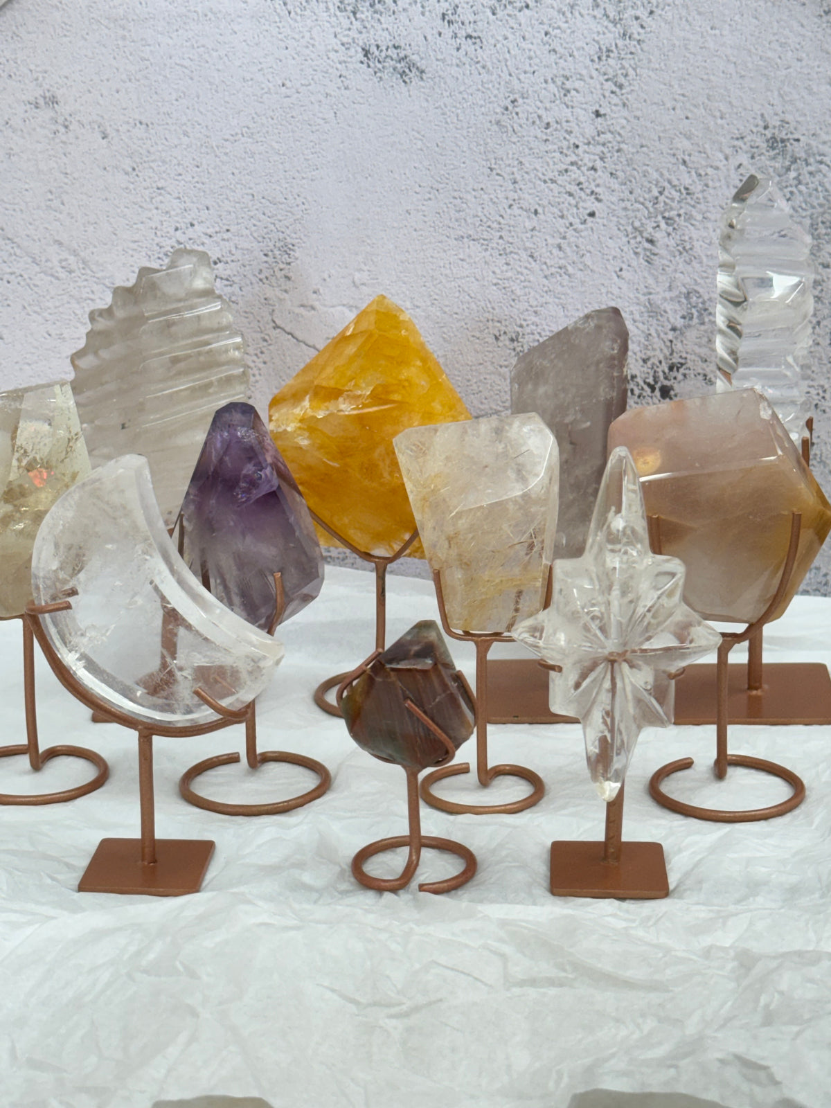 Assorted crystals on stands